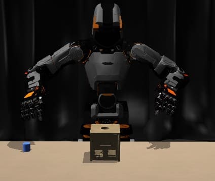 A robot with outstretched arms sits at a table with a small blue cylinder and a wooden cube with a hole in the center, against a dark curtain background.